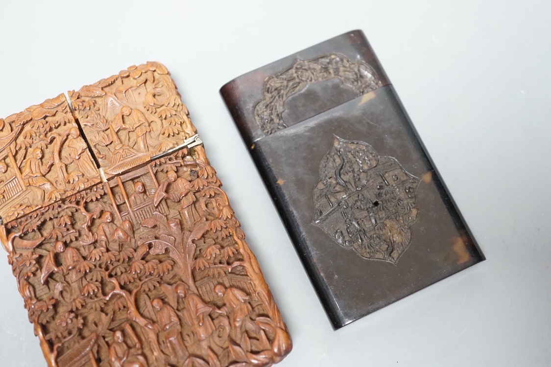 A 19th century Chinese tortoiseshell card case and a similar carved sandalwood card case, 11 cms high x 7 cms wide.